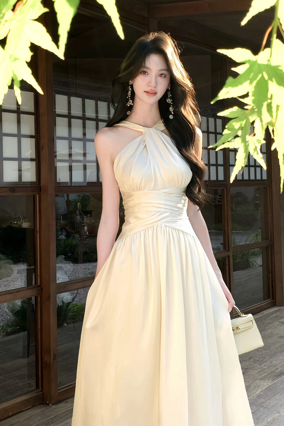 Woman in a beige dress standing in a traditional Japanese garden setting